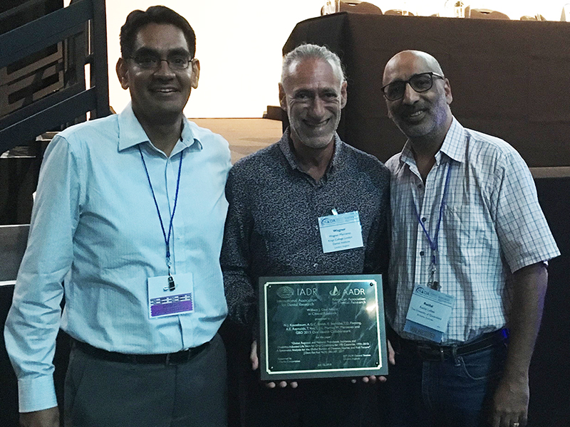 Dr Eduardo Bernabé and Professor Wagner Marcenes from Kings College London with UQ’s Associate Professor Ratilal Lalloo.